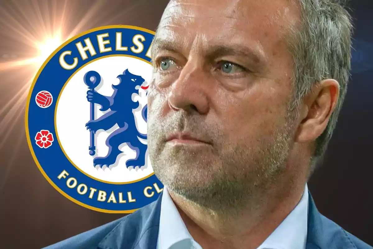 A grey-haired man with a serious expression in front of the Chelsea FC logo.