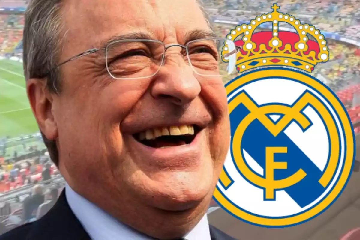 Florentino Pérez with a big smile next to the Real Madrid shield