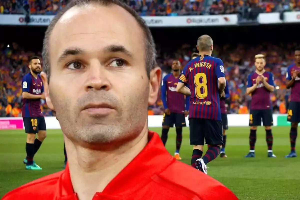 Former Barça footballer Andrés Iniesta in the foreground next to a photo of the day the player from Albacete said goodbye to the Catalan club.