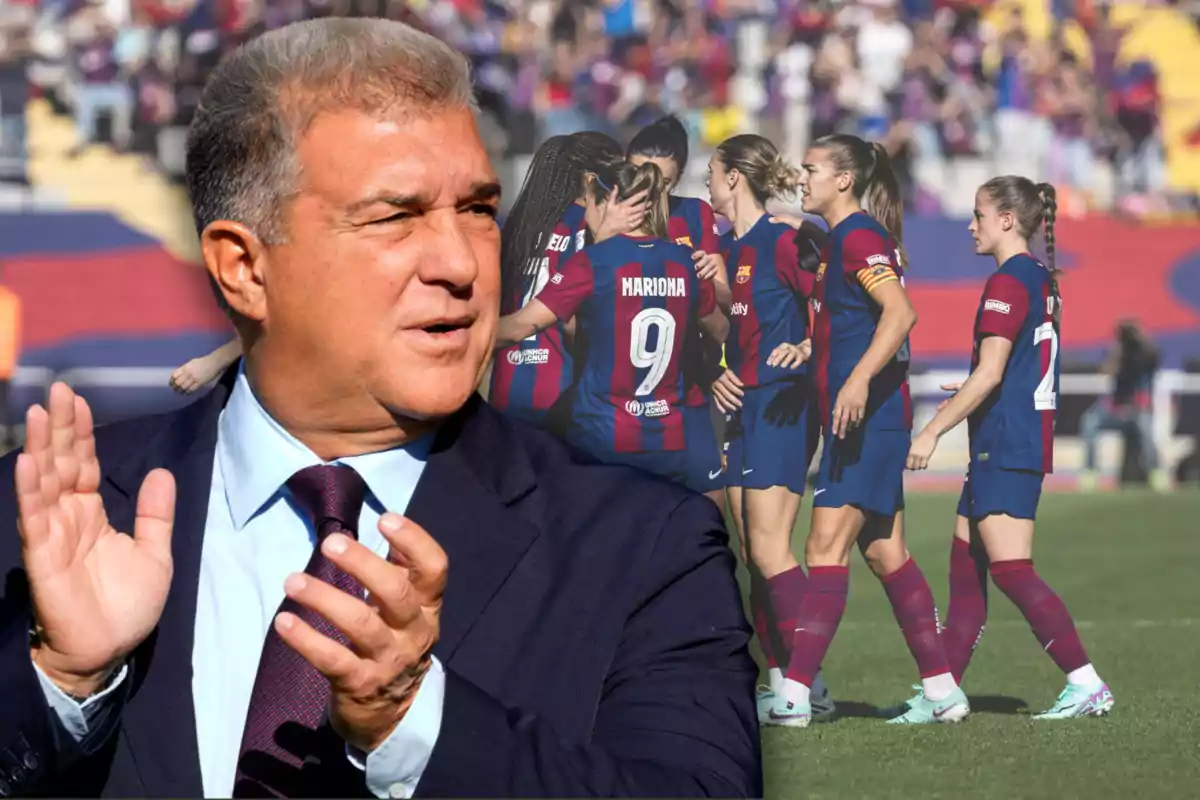 A man clapping with a group of female soccer players celebrating in the background.