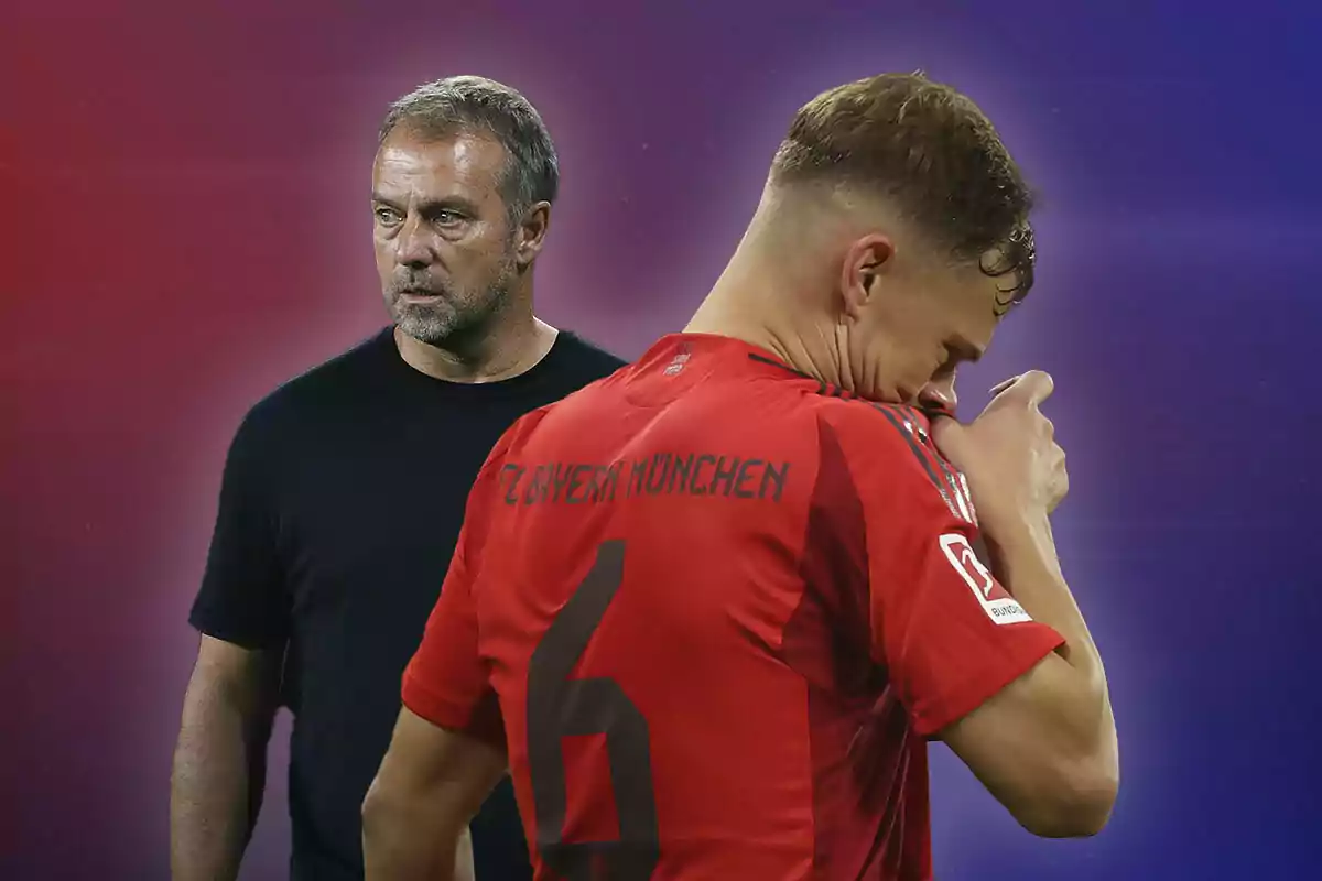 Hansi Flick in a black T-jersey looks at a Bayern Munich soccer player who appears to be wiping his face with his red T-jersey.