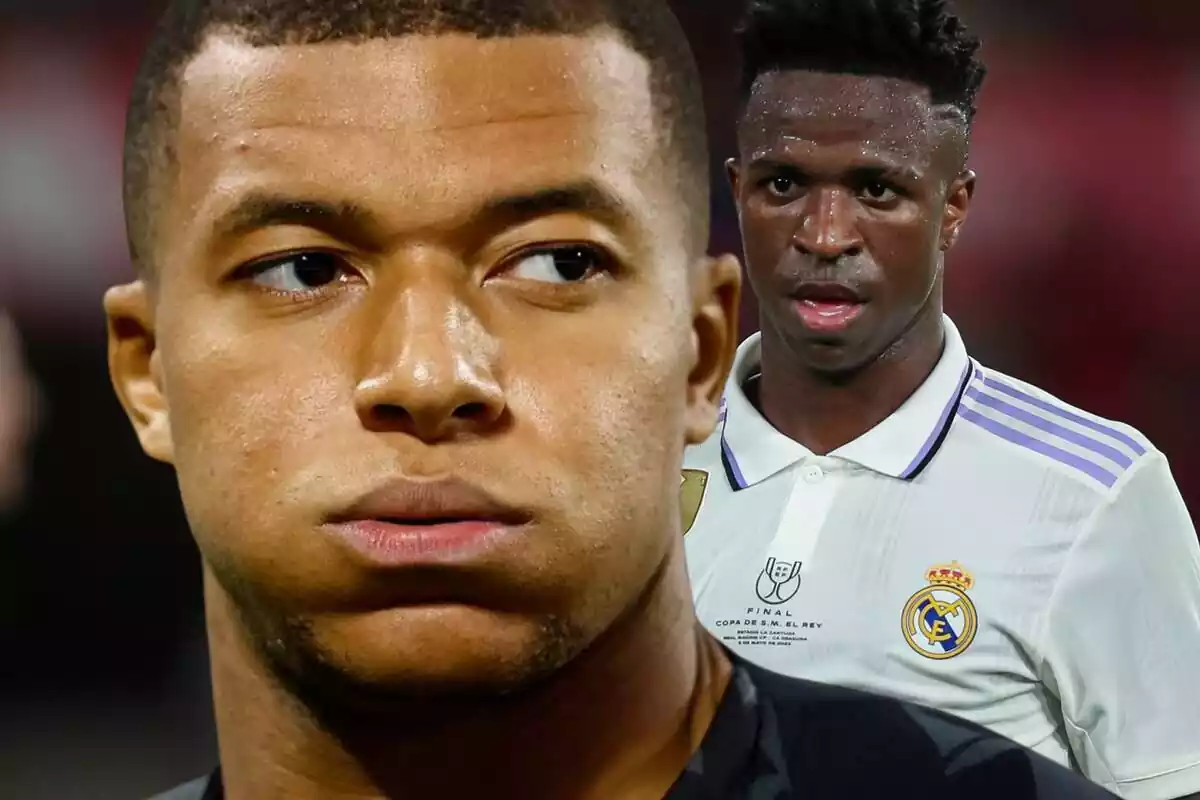 Kylian Mbappé sighs next to Vinícius Júnior, who looks at him in amazement with the Real Madrid shirt