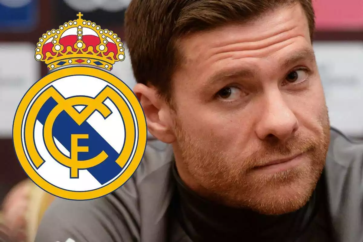 Xabi Alonso next to the Real Madrid shield